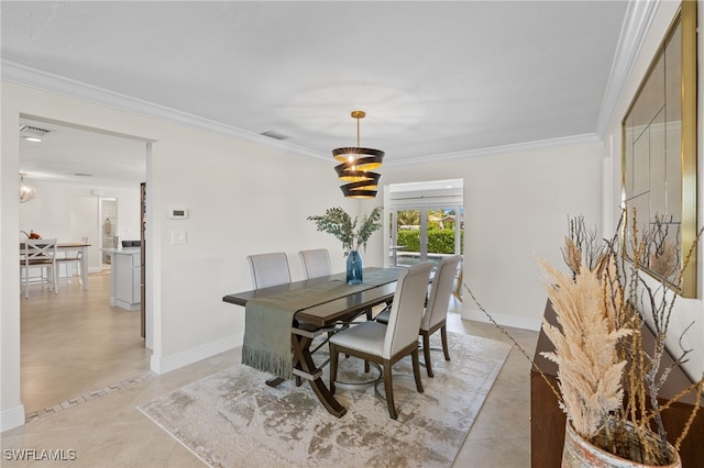 dining space with baseboards and crown molding