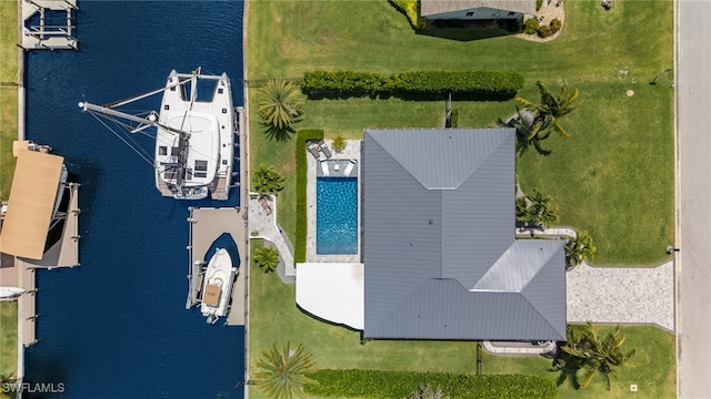 birds eye view of property with a water view