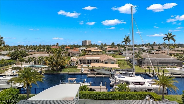 bird's eye view with a water view and a residential view