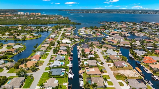 aerial view featuring a residential view and a water view