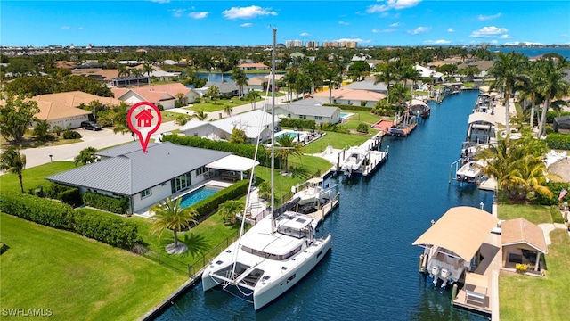 bird's eye view with a water view and a residential view
