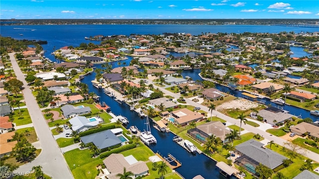 aerial view featuring a residential view and a water view