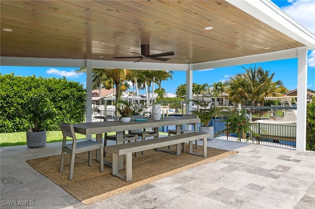 view of patio / terrace with outdoor dining area and a ceiling fan
