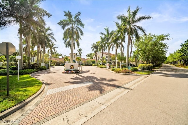 4665 Saint Croix Ln Unit 1525, Naples, FL 34109 - view of home's community with decorative driveway and a gate