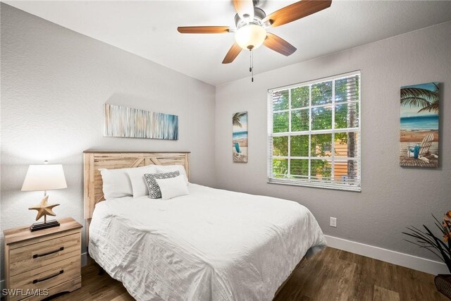 4665 Saint Croix Ln Unit 1525, Naples, FL 34109 - bedroom with a ceiling fan, baseboards, and wood finished floors