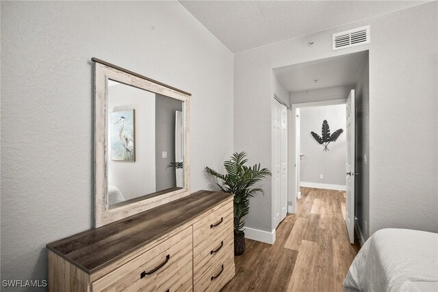 4665 Saint Croix Ln Unit 1525, Naples, FL 34109 - bedroom with dark wood-style floors, baseboards, and visible vents