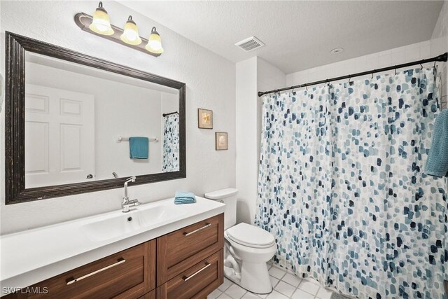 4665 Saint Croix Ln Unit 1525, Naples, FL 34109 - full bathroom with toilet, vanity, a textured ceiling, tile patterned flooring, and visible vents