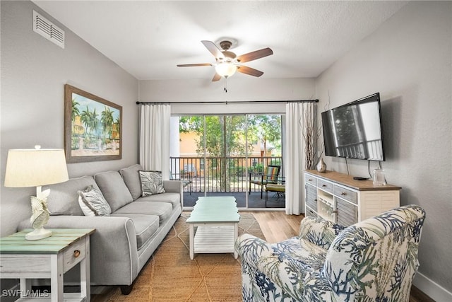 4665 Saint Croix Ln Unit 1525, Naples, FL 34109 - living area featuring a ceiling fan, baseboards, and visible vents