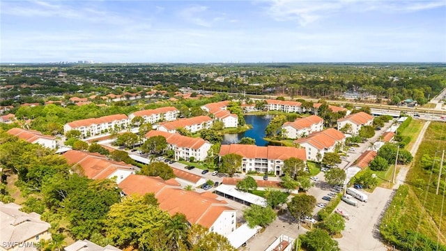 4665 Saint Croix Ln Unit 1525, Naples, FL 34109 - drone / aerial view with a water view
