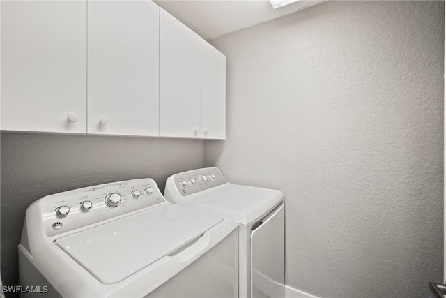 4665 Saint Croix Ln Unit 1525, Naples, FL 34109 - laundry area with a textured wall, cabinet space, and washer and clothes dryer