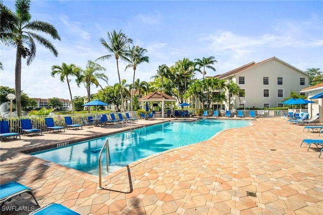 4665 Saint Croix Ln Unit 1525, Naples, FL 34109 - pool featuring a gazebo, fence, and a patio area