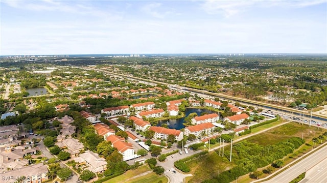 4665 Saint Croix Ln Unit 1525, Naples, FL 34109 - drone / aerial view with a residential view and a water view