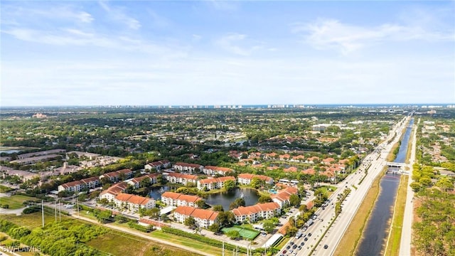 4665 Saint Croix Ln Unit 1525, Naples, FL 34109 - birds eye view of property with a water view
