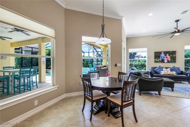 9337 Campanile Cir, Naples, FL 34114 - dining room featuring light tile patterned flooring, visible vents, baseboards, ceiling fan, and ornamental molding
