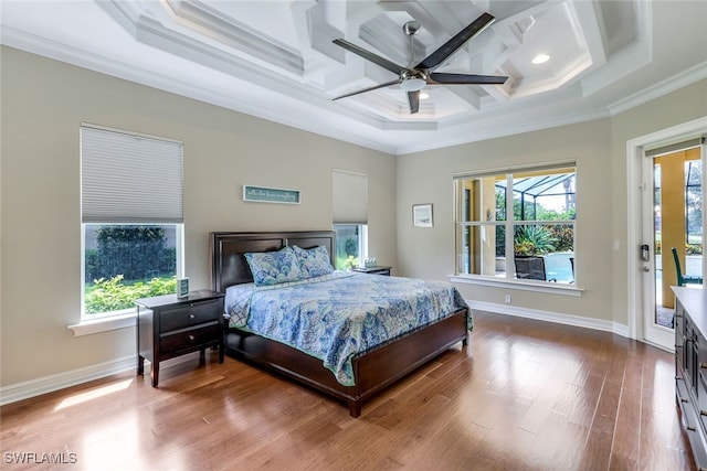 9337 Campanile Cir, Naples, FL 34114 - bedroom featuring coffered ceiling, multiple windows, crown molding, and wood finished floors