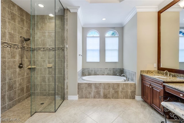 9337 Campanile Cir, Naples, FL 34114 - bathroom with vanity, a tile shower, ornamental molding, tile patterned floors, and a garden tub