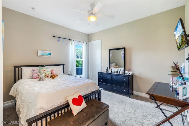9337 Campanile Cir, Naples, FL 34114 - carpeted bedroom with baseboards and a ceiling fan