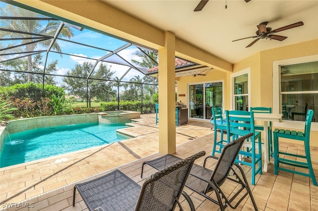 9337 Campanile Cir, Naples, FL 34114 - view of swimming pool featuring glass enclosure, ceiling fan, a pool with connected hot tub, and a patio area