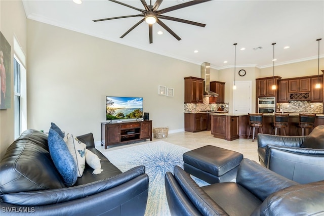 9337 Campanile Cir, Naples, FL 34114 - living room with baseboards, crown molding, and ceiling fan