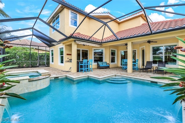 9337 Campanile Cir, Naples, FL 34114 - view of swimming pool with glass enclosure, ceiling fan, a pool with connected hot tub, and a patio area