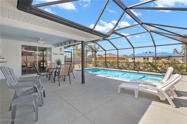 1015 SE 25th Ln, Cape Coral, FL 33904 - outdoor pool featuring ceiling fan, a lanai, and a patio area