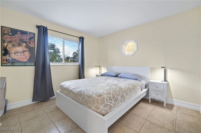1015 SE 25th Ln, Cape Coral, FL 33904 - bedroom with light tile patterned floors and baseboards