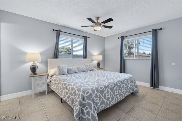 1015 SE 25th Ln, Cape Coral, FL 33904 - bedroom with light tile patterned flooring, multiple windows, and baseboards