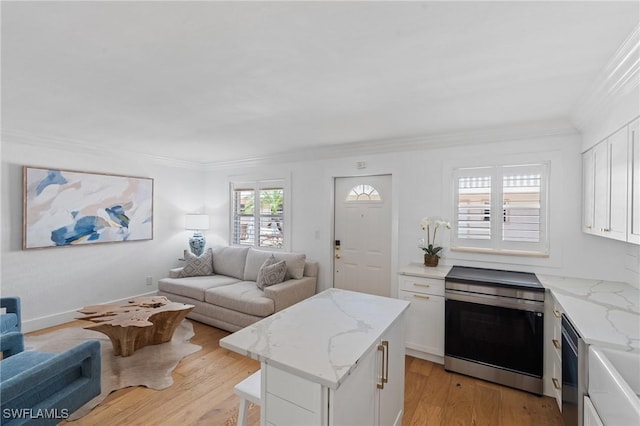 980 7th Ave S Unit 107, Naples, FL 34102 - living area featuring ornamental molding and light wood finished floors