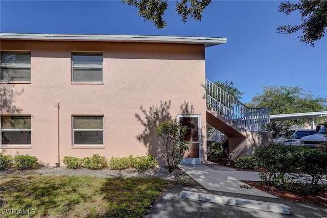 view of property featuring stairs