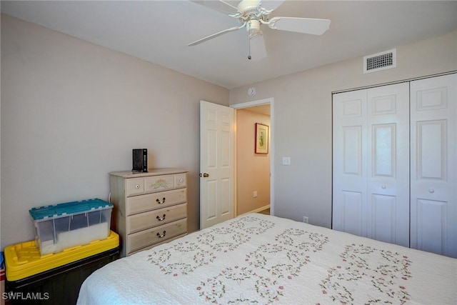 bedroom with visible vents, a closet, and ceiling fan