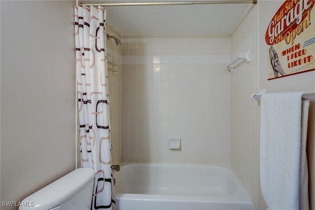 bathroom with toilet and shower / bath combination with curtain