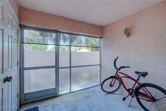 unfurnished sunroom featuring plenty of natural light