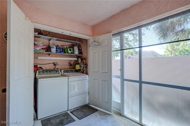laundry area with separate washer and dryer and laundry area