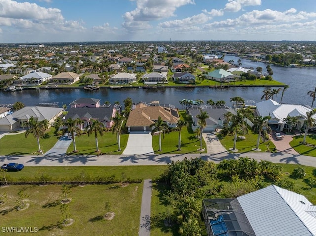 aerial view featuring a water view and a residential view