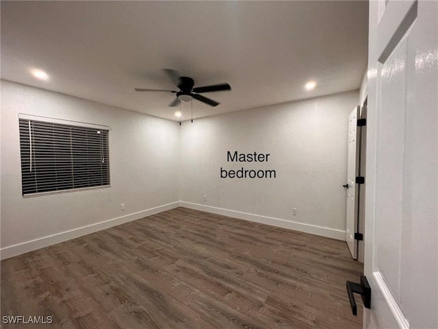 spare room featuring dark wood-style floors, recessed lighting, ceiling fan, and baseboards
