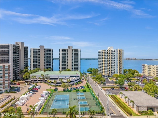 drone / aerial view featuring a water view and a city view