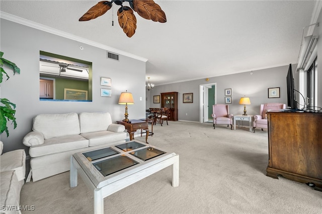 living area featuring crown molding, visible vents, light carpet, and ceiling fan with notable chandelier