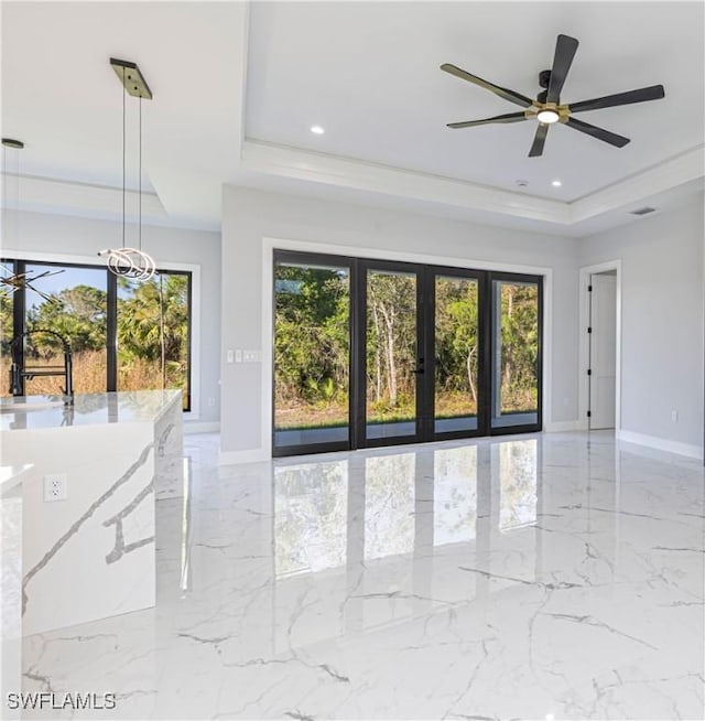 157 Everglades Blvd S, Naples, FL 34117 - unfurnished room featuring a raised ceiling, healthy amount of natural light, ceiling fan, and recessed lighting