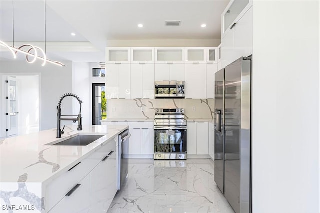 157 Everglades Blvd S, Naples, FL 34117 - kitchen with appliances with stainless steel finishes, modern cabinets, white cabinets, and recessed lighting