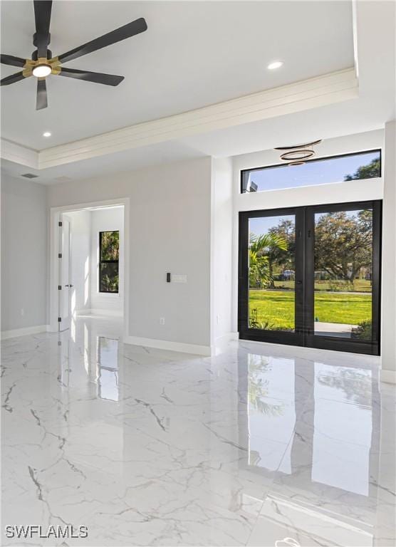 157 Everglades Blvd S, Naples, FL 34117 - empty room featuring a raised ceiling, french doors, plenty of natural light, light marble finish floors, and recessed lighting