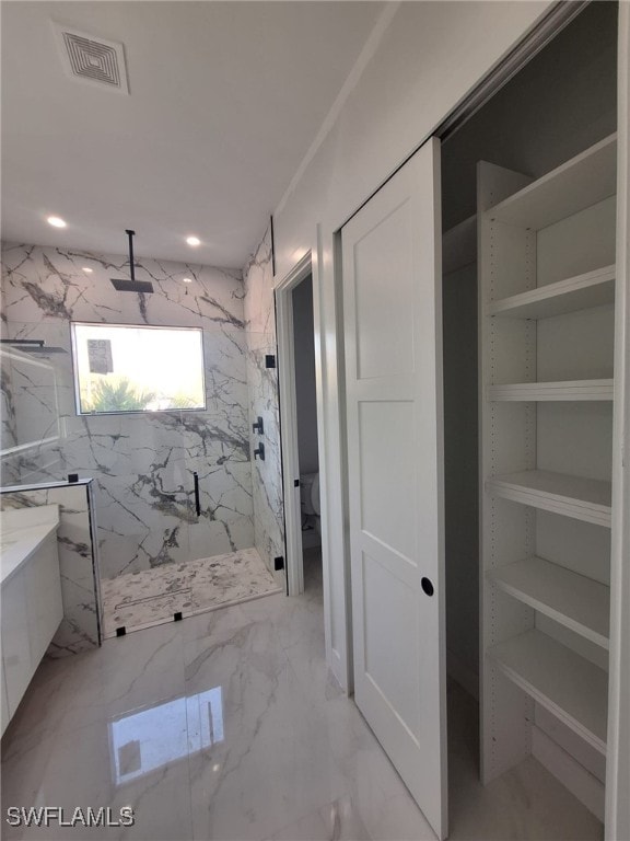157 Everglades Blvd S, Naples, FL 34117 - bathroom featuring a marble finish shower, a closet, marble finish floors, and vanity