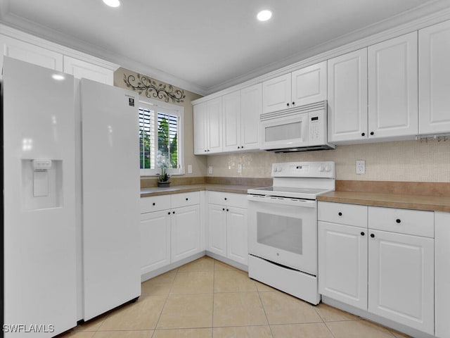 3904 SW 20th Ave, Cape Coral, FL 33914 - kitchen with white cabinetry, light tile patterned floors, ornamental molding, and white appliances