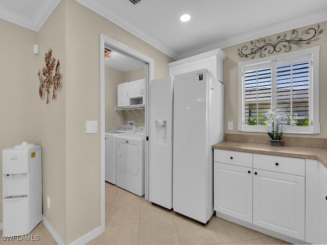 3904 SW 20th Ave, Cape Coral, FL 33914 - laundry room featuring crown molding, baseboards, washing machine and clothes dryer, light tile patterned flooring, and laundry area