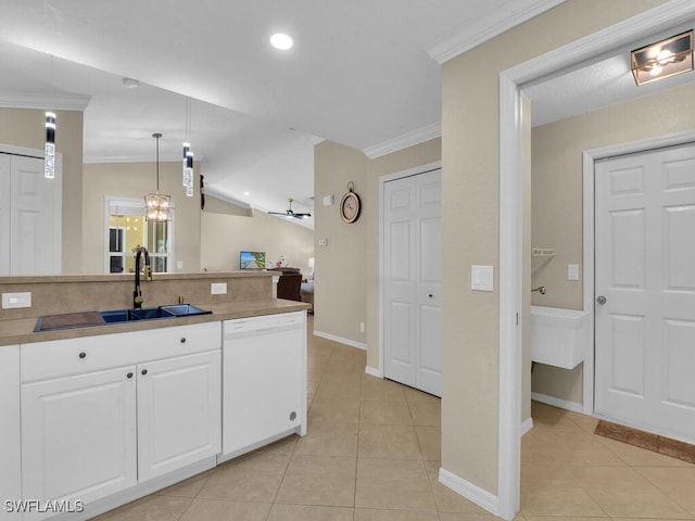3904 SW 20th Ave, Cape Coral, FL 33914 - kitchen featuring light tile patterned flooring, white cabinets, a sink, and dishwasher