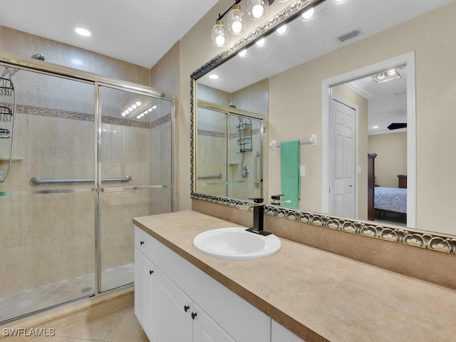 3904 SW 20th Ave, Cape Coral, FL 33914 - ensuite bathroom featuring connected bathroom, a stall shower, visible vents, and vanity