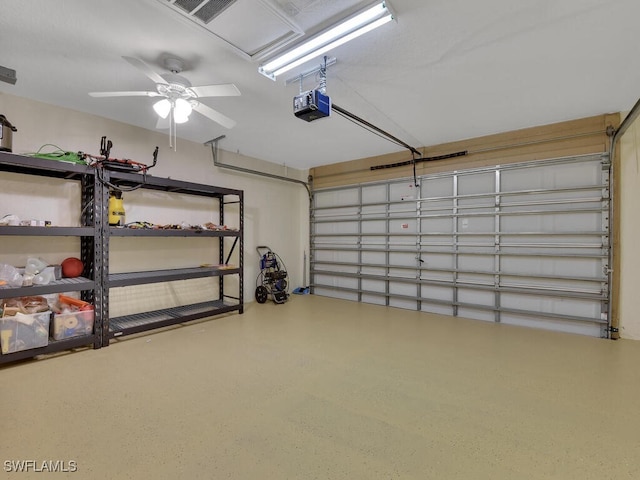 3904 SW 20th Ave, Cape Coral, FL 33914 - garage with a garage door opener and a ceiling fan