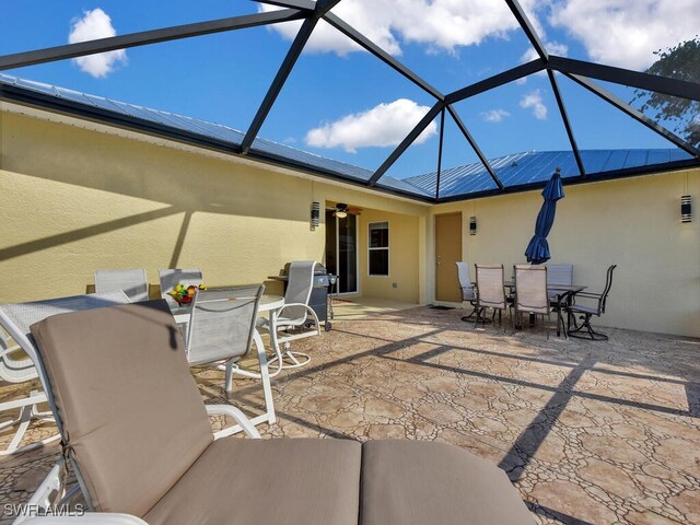3904 SW 20th Ave, Cape Coral, FL 33914 - view of patio with grilling area, outdoor dining area, a lanai, and ceiling fan