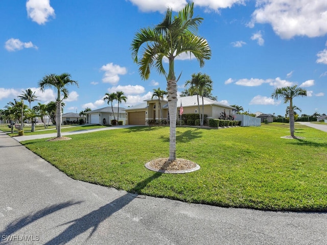 3904 SW 20th Ave, Cape Coral, FL 33914 - single story home with driveway, a garage, and a front lawn