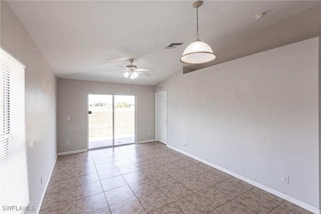 empty room featuring baseboards, visible vents, light tile patterned floors, and a ceiling fan