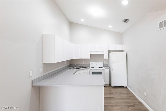 kitchen with light countertops, a sink, under cabinet range hood, white appliances, and white cabinets